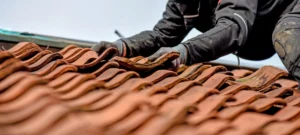 A technician repairing a roof in Gilbert, AZ